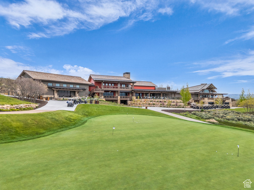 View of property\'s community with a putting green and golf course view