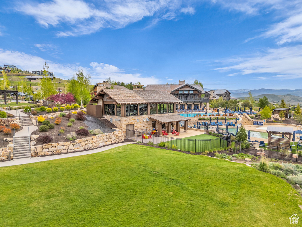 Rear view of property featuring a mountain view