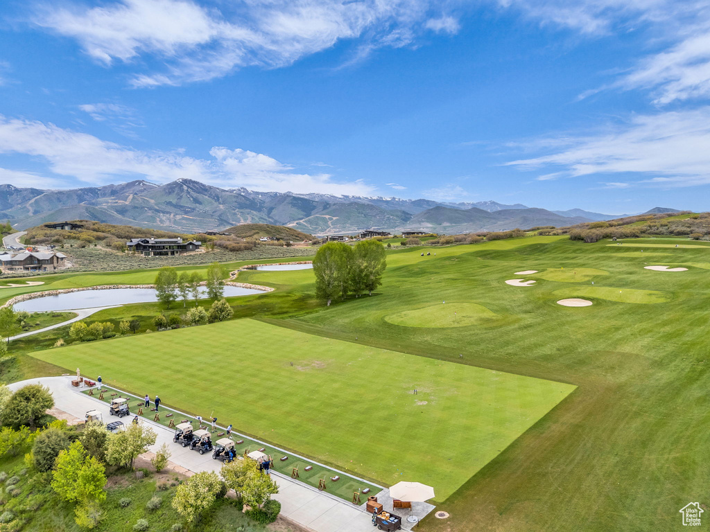 View of property\'s community with a water and mountain view and golf course view