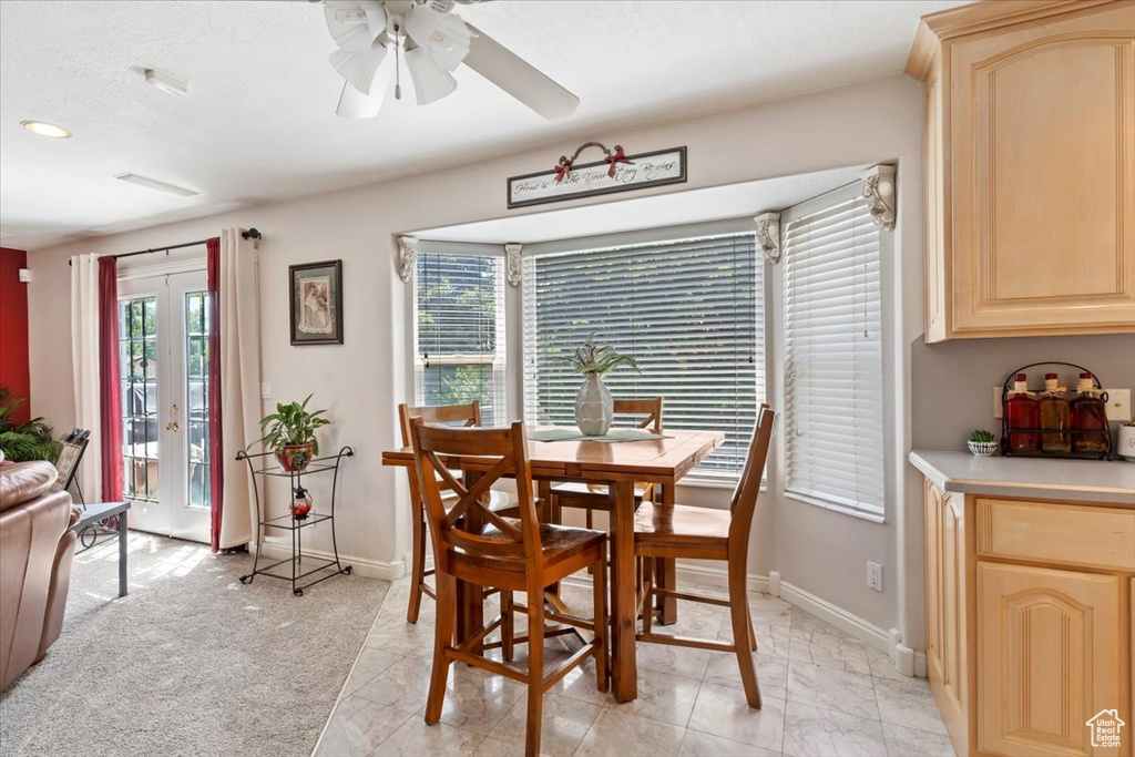 Dining area featuring ceiling fan, recessed lighting, and light marble finish floors