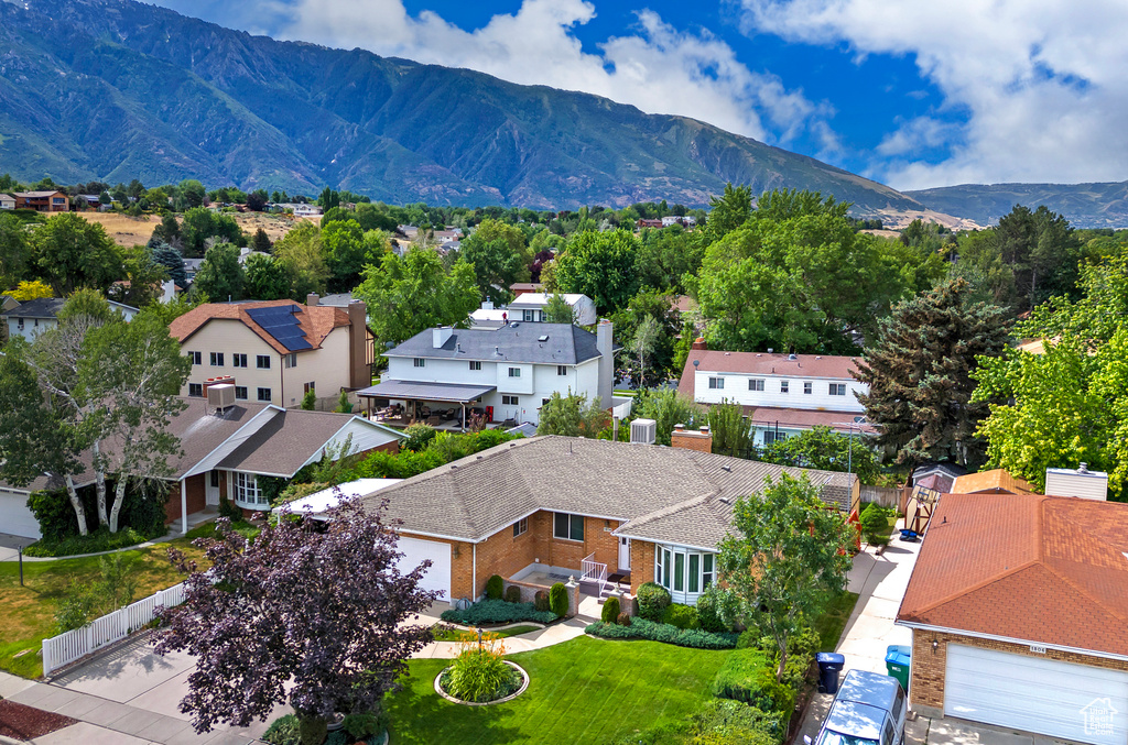 View of mountain backdrop featuring nearby suburban area