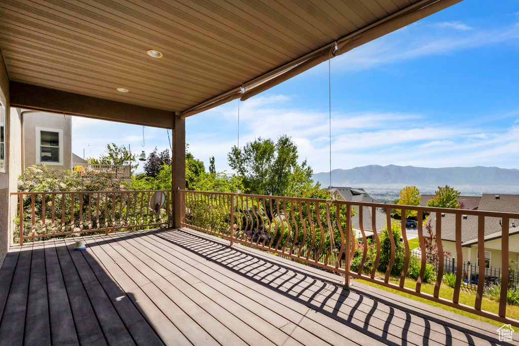 Wooden terrace featuring a mountain view