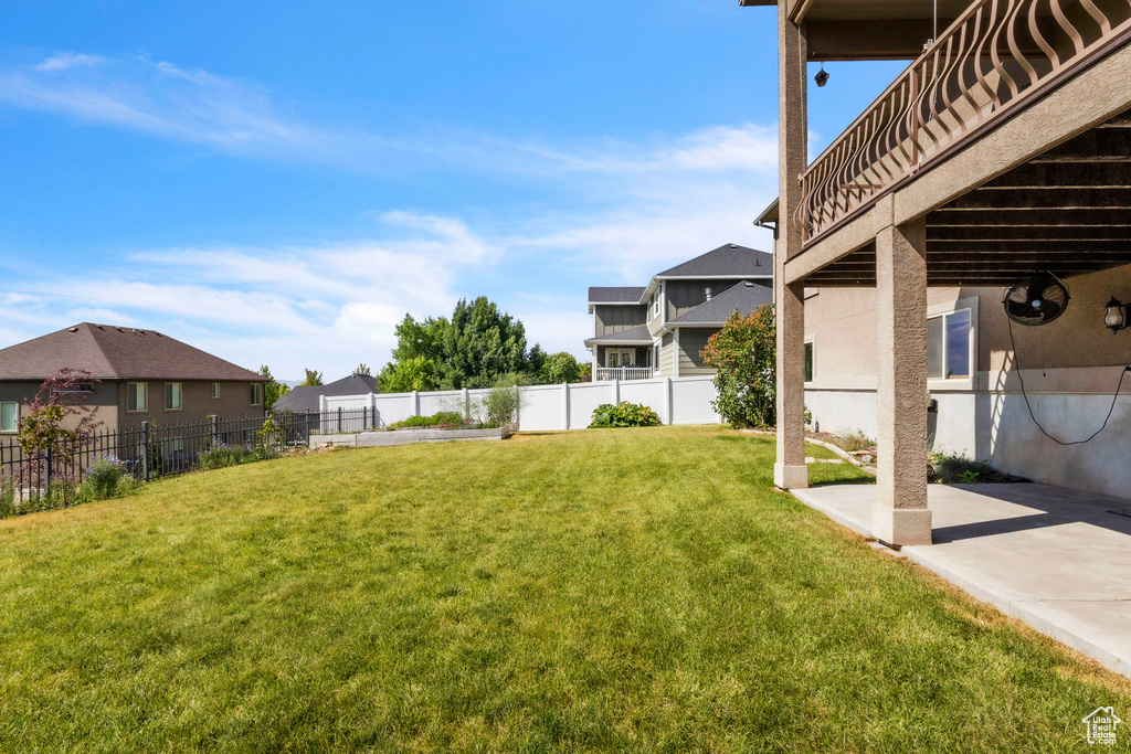 View of yard featuring a patio and a residential view