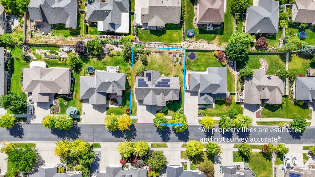 Aerial view of residential area with property boundaries highlighted