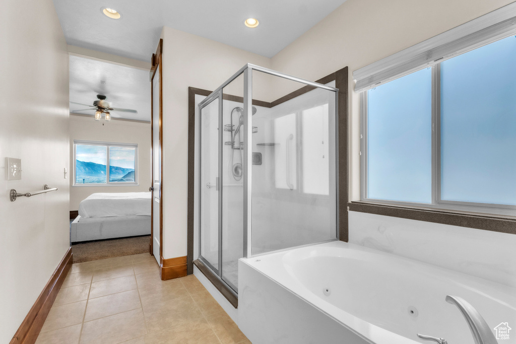 Bathroom featuring ensuite bathroom, a shower stall, a tub with jets, tile patterned flooring, and ceiling fan