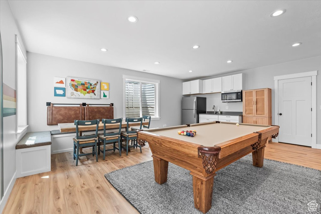 Rec room featuring light wood-style floors, recessed lighting, and billiards