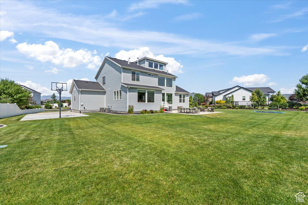 Back of property featuring a patio area