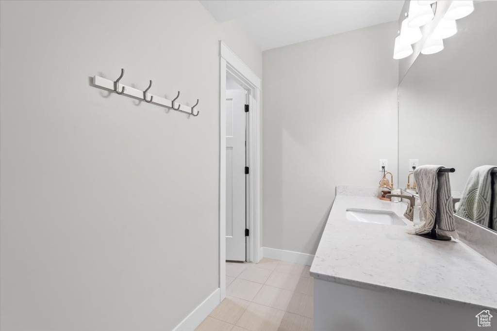 Bathroom featuring vanity and tile patterned floors