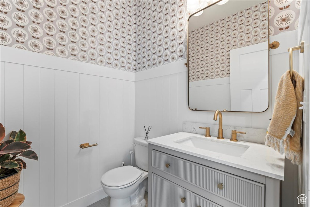 Bathroom with vanity and wainscoting