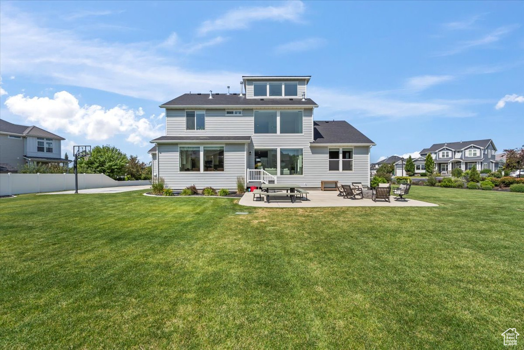 Rear view of house featuring a patio