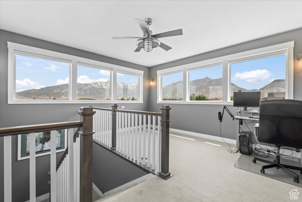 Office space with carpet flooring and ceiling fan