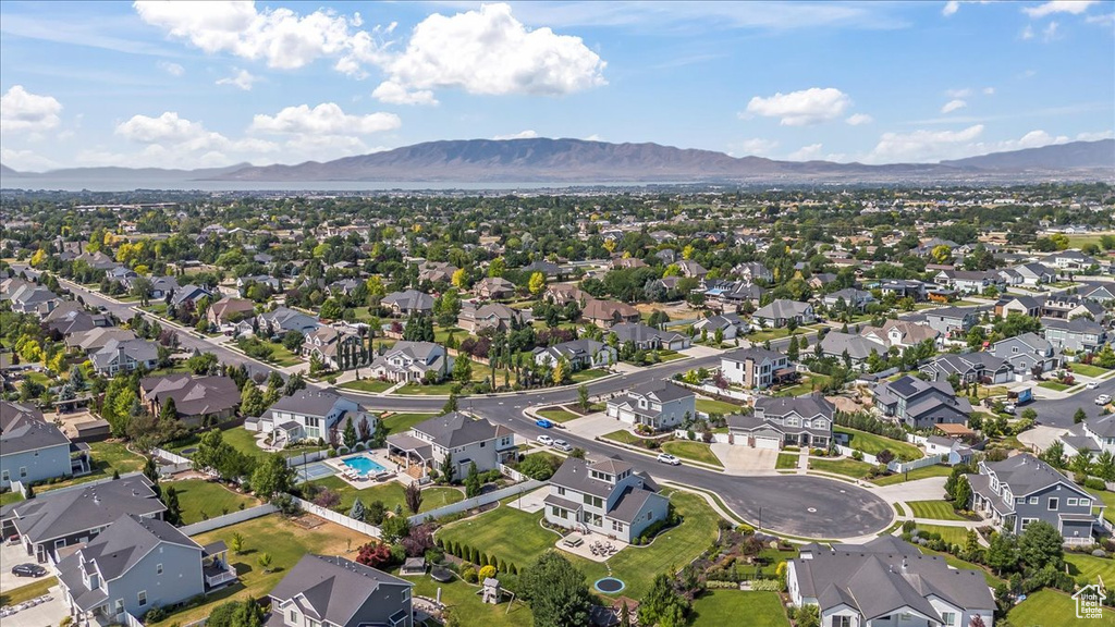 Aerial view of property\'s location with a mountain backdrop and nearby suburban area