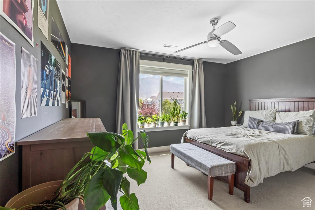 Bedroom featuring carpet and a ceiling fan
