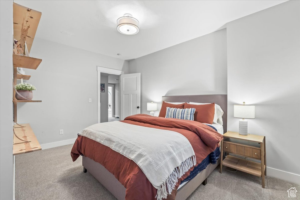 Bedroom with carpet and baseboards