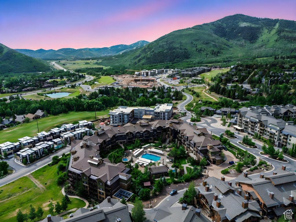 View of property location with a water and mountain view and a local golf course