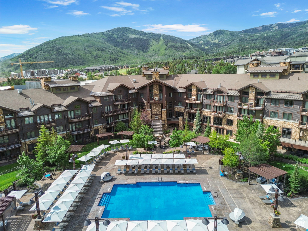 View of swimming pool with a mountain view and a residential view