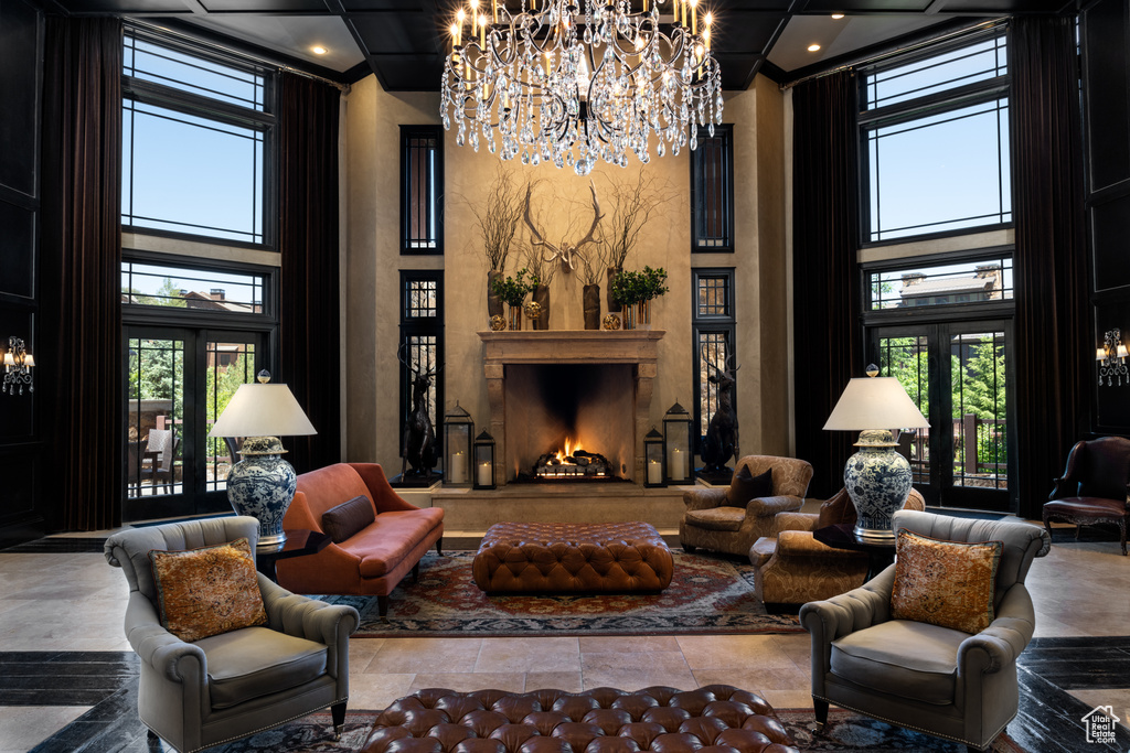 Living area featuring a chandelier and a towering ceiling