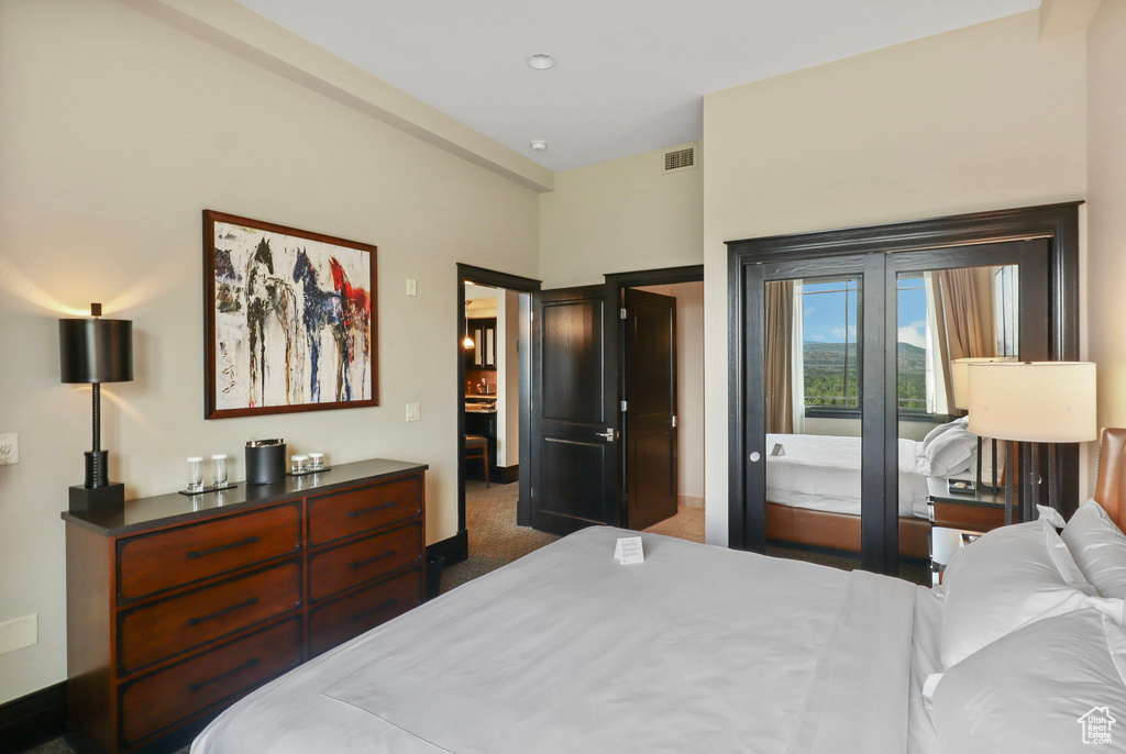 Carpeted bedroom with baseboards