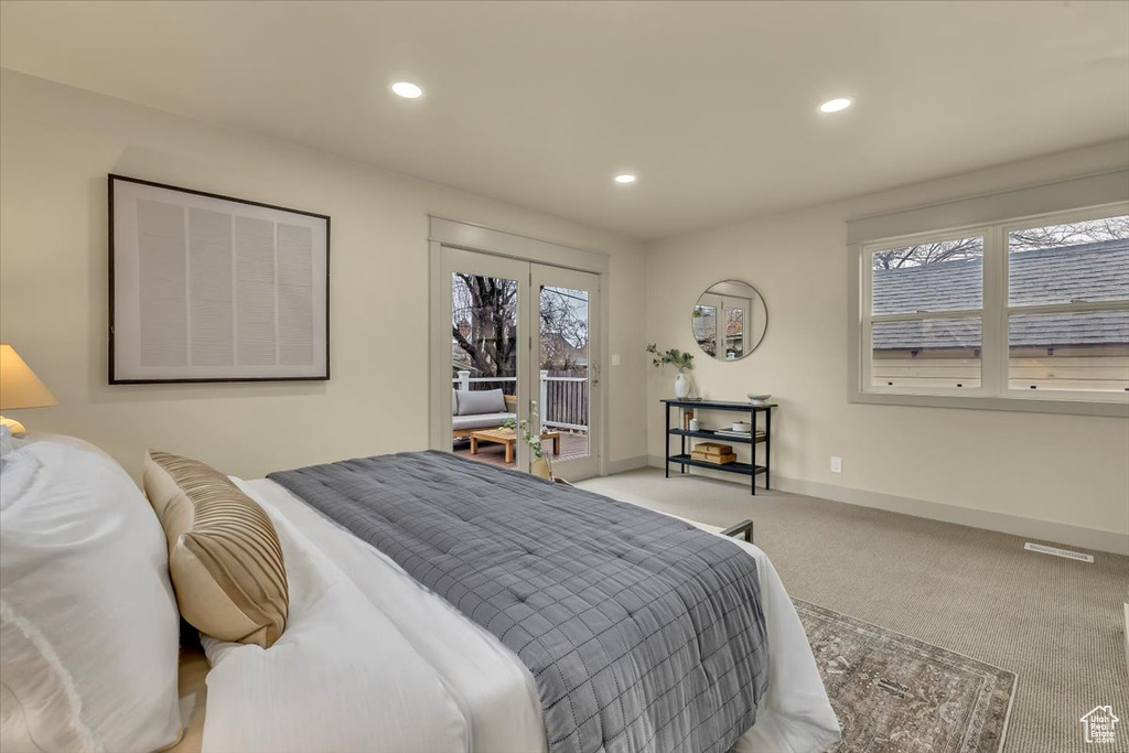 Carpeted bedroom featuring access to exterior and recessed lighting