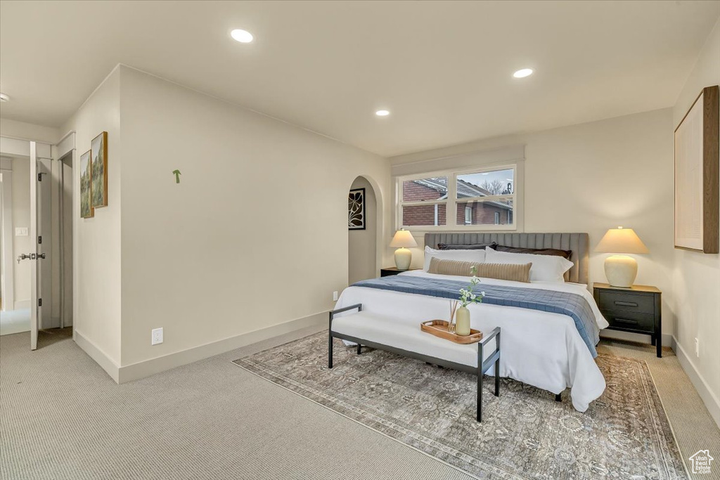 Bedroom featuring light carpet and recessed lighting