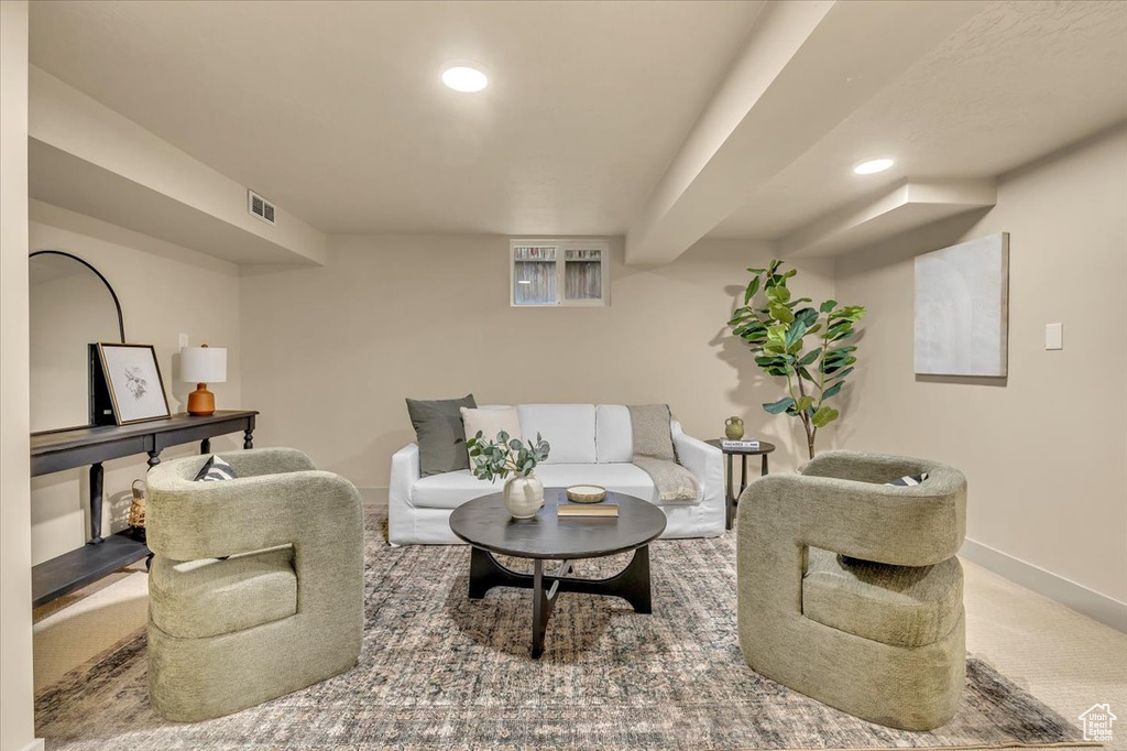 Living area featuring recessed lighting and carpet