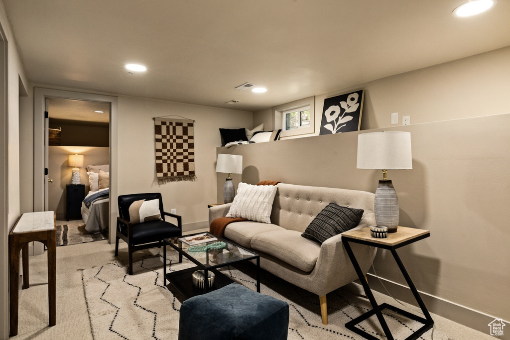 Living room featuring recessed lighting and light carpet