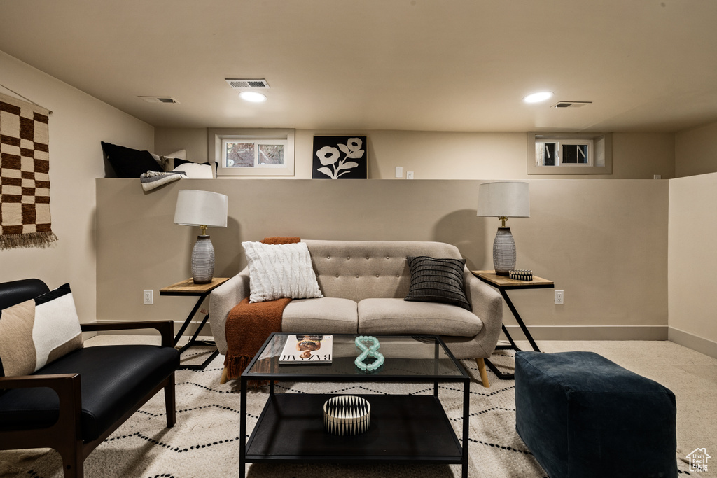 Living area featuring baseboards and recessed lighting