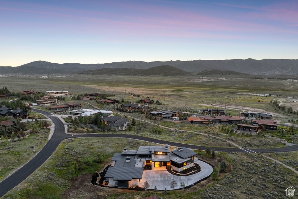 Aerial overview of property\'s location featuring a mountain backdrop
