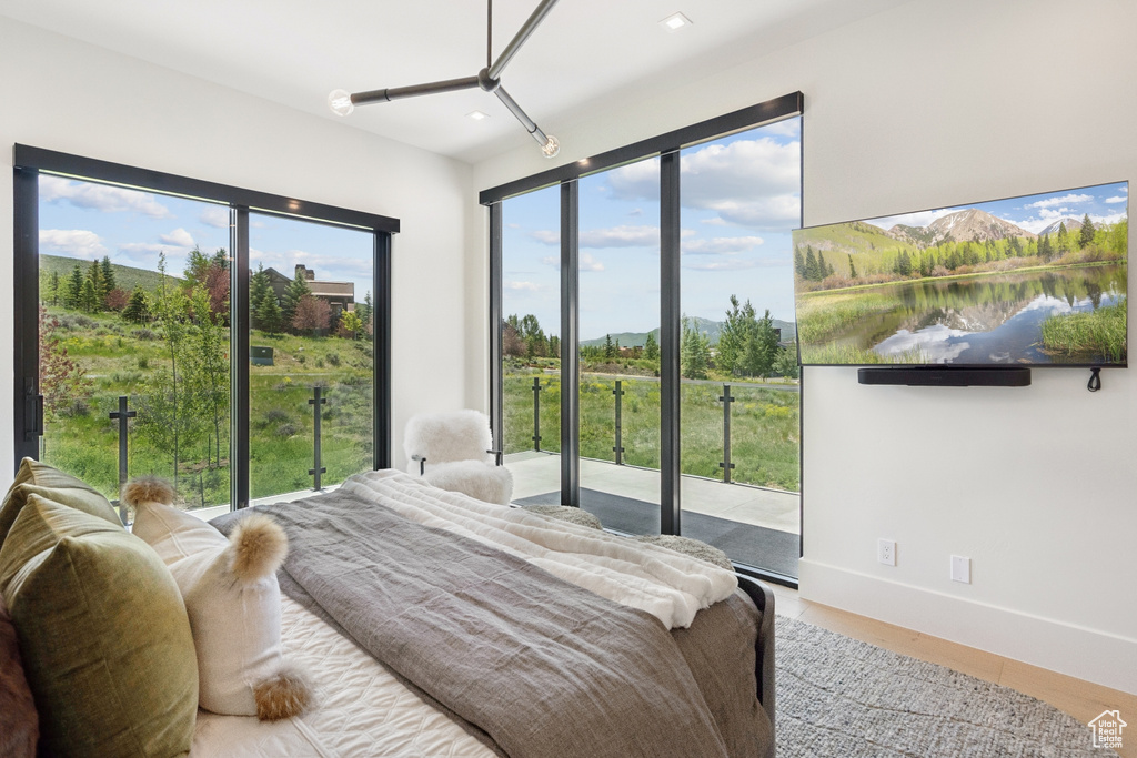 Bedroom featuring recessed lighting and access to exterior