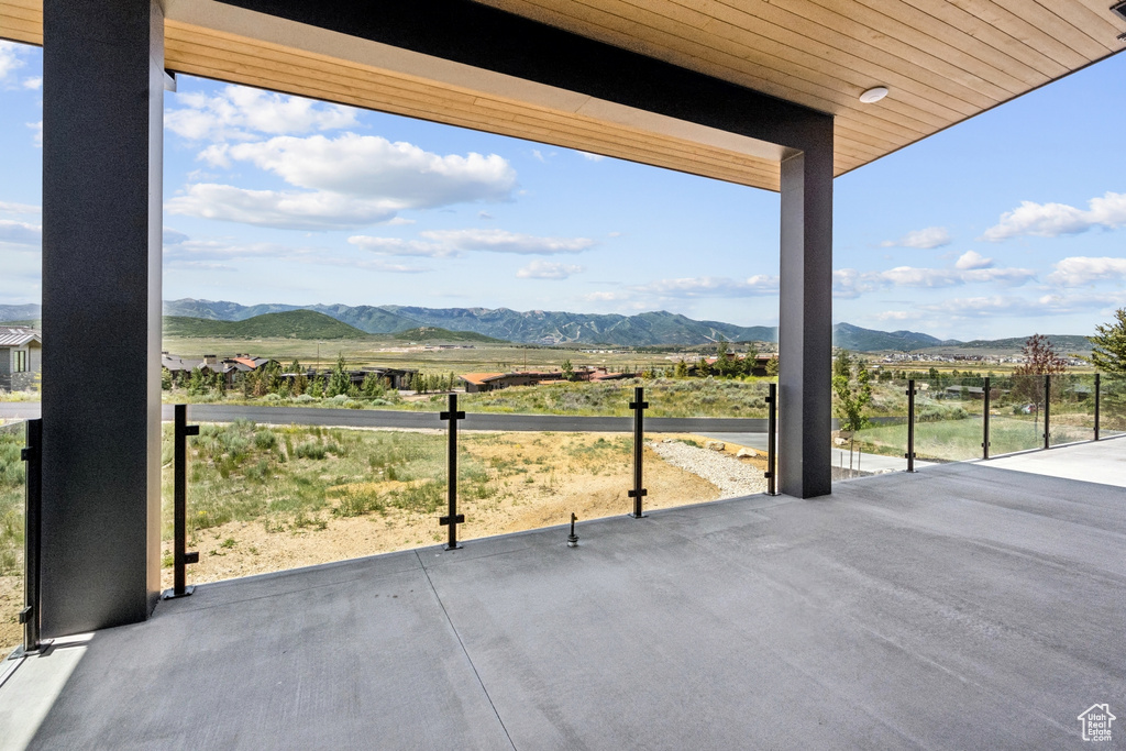 View of patio featuring a mountain view and a rural view