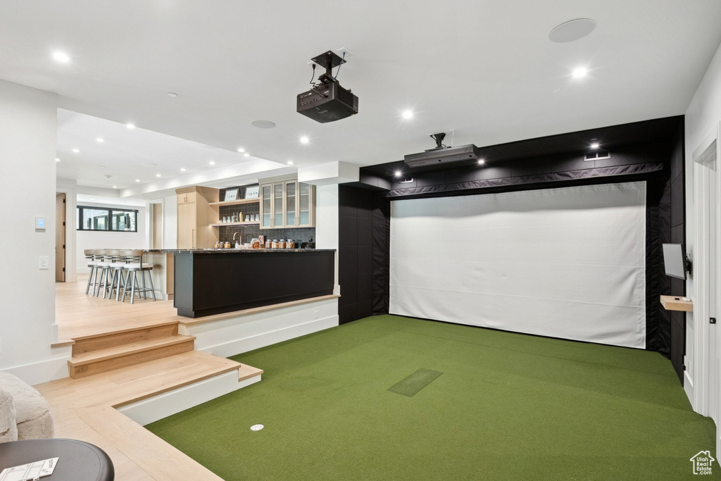 Playroom featuring golf simulator and recessed lighting