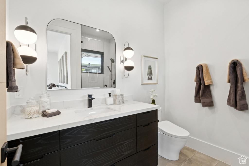 Full bath featuring vanity and tile patterned flooring