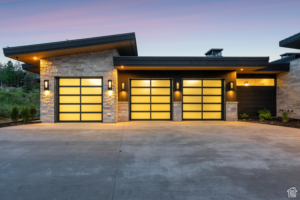 Garage at dusk with driveway