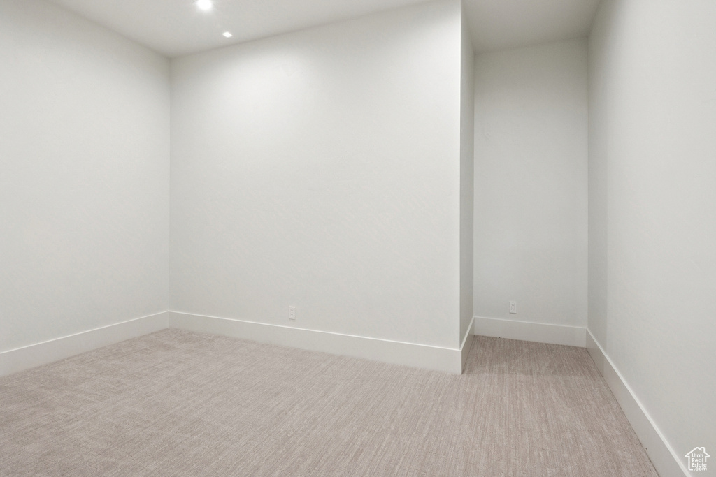 Spare room featuring light carpet and recessed lighting