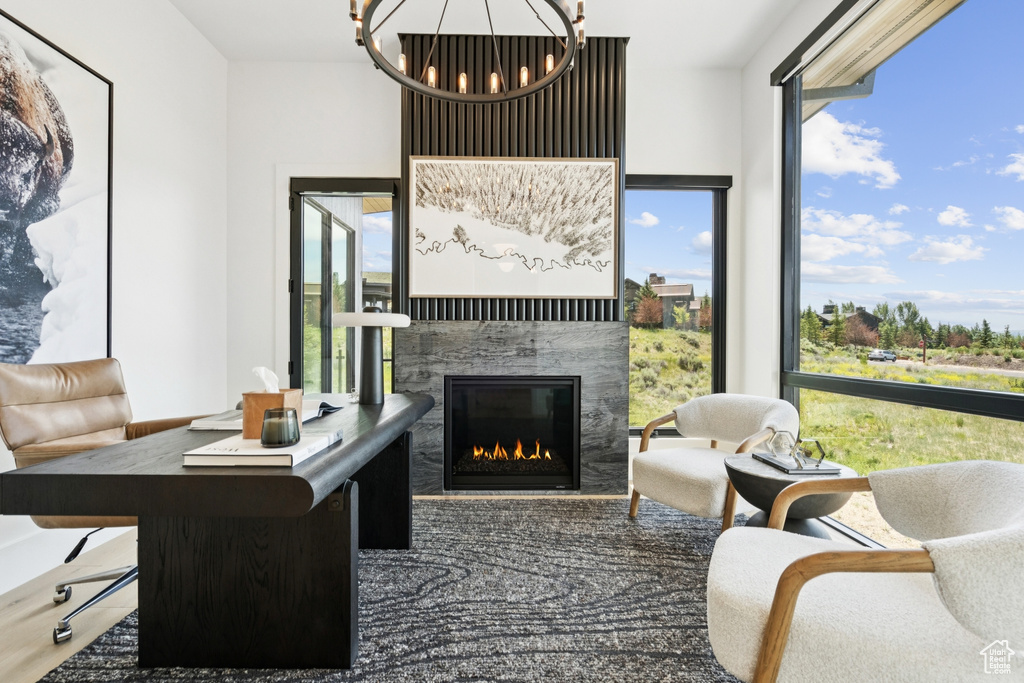Living room with a fireplace and a chandelier