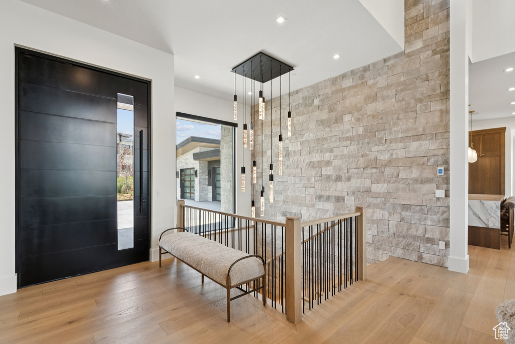 Entrance foyer with wood finished floors and recessed lighting