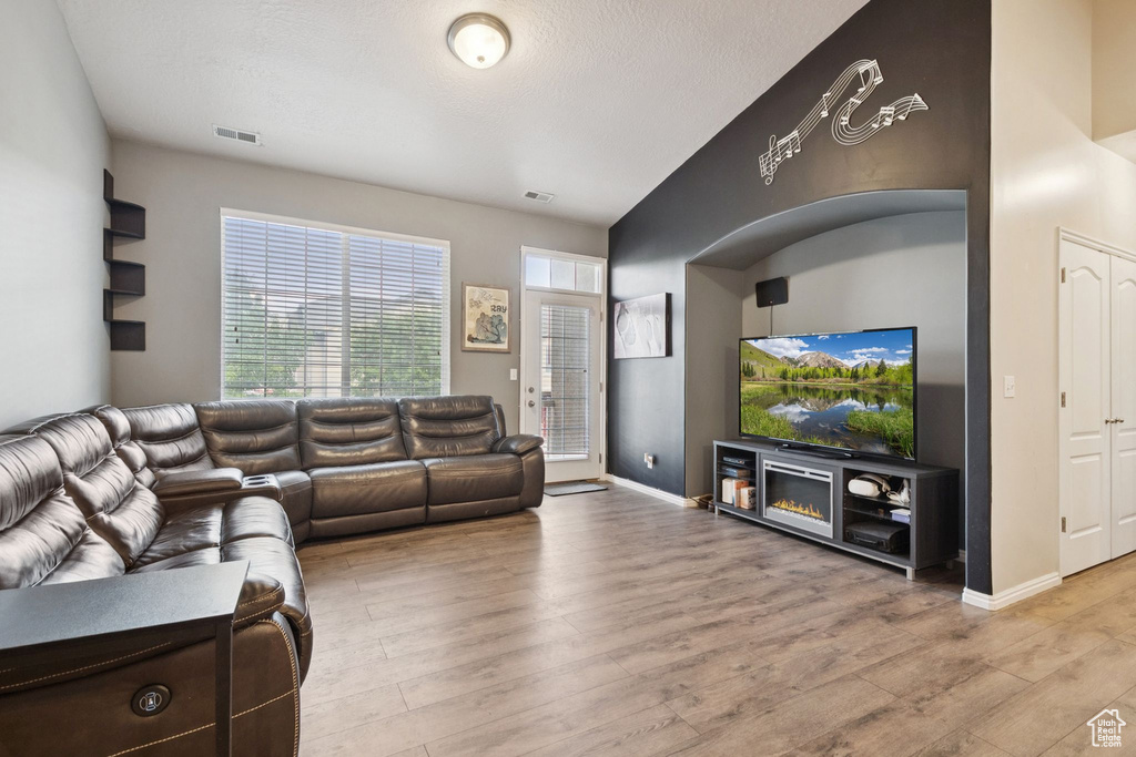 Living area featuring light wood finished floors and baseboards
