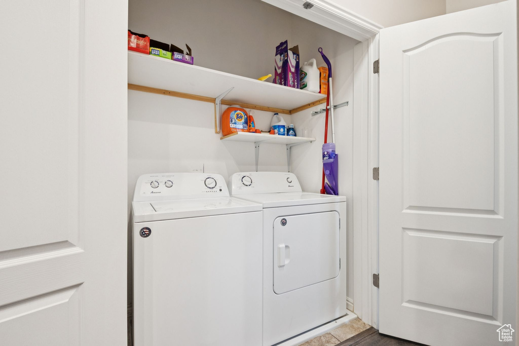 Laundry room featuring independent washer and dryer