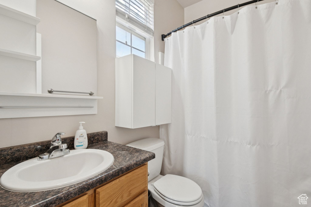 Bathroom featuring vanity and a shower with curtain