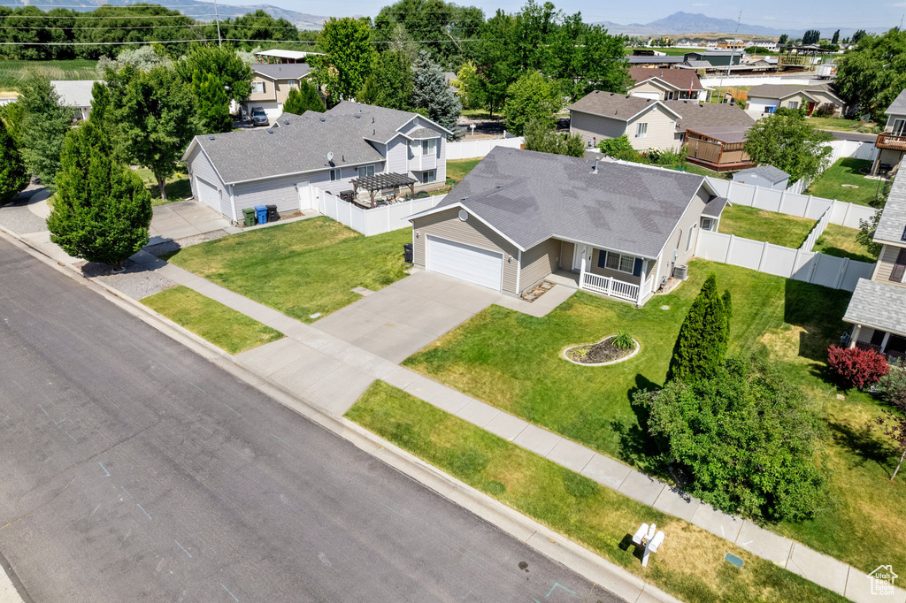 Aerial perspective of suburban area featuring a mountain backdrop