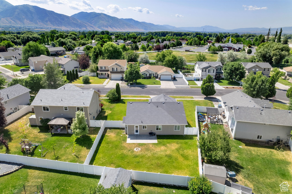 Aerial view of residential area featuring mountains