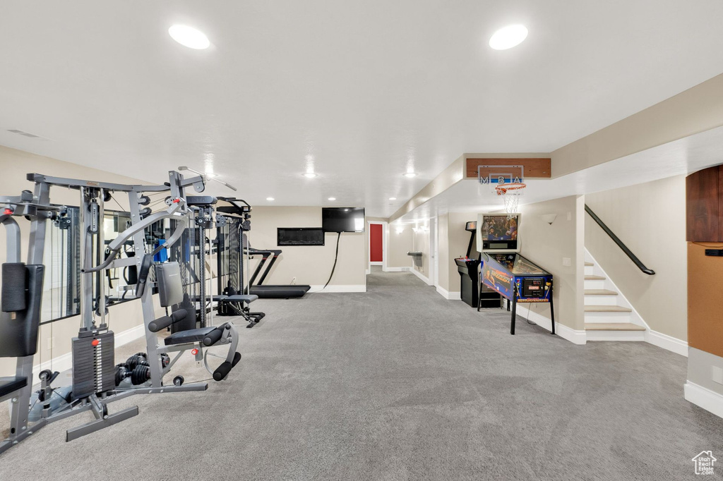 Exercise area with baseboards and recessed lighting