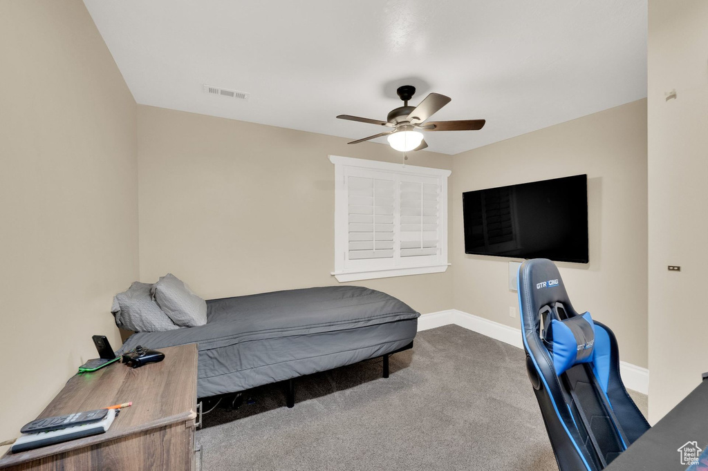 Bedroom with carpet and ceiling fan
