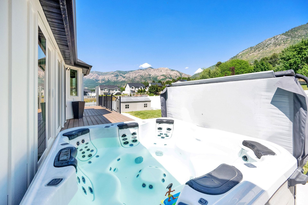 Exterior space featuring mountains and a hot tub