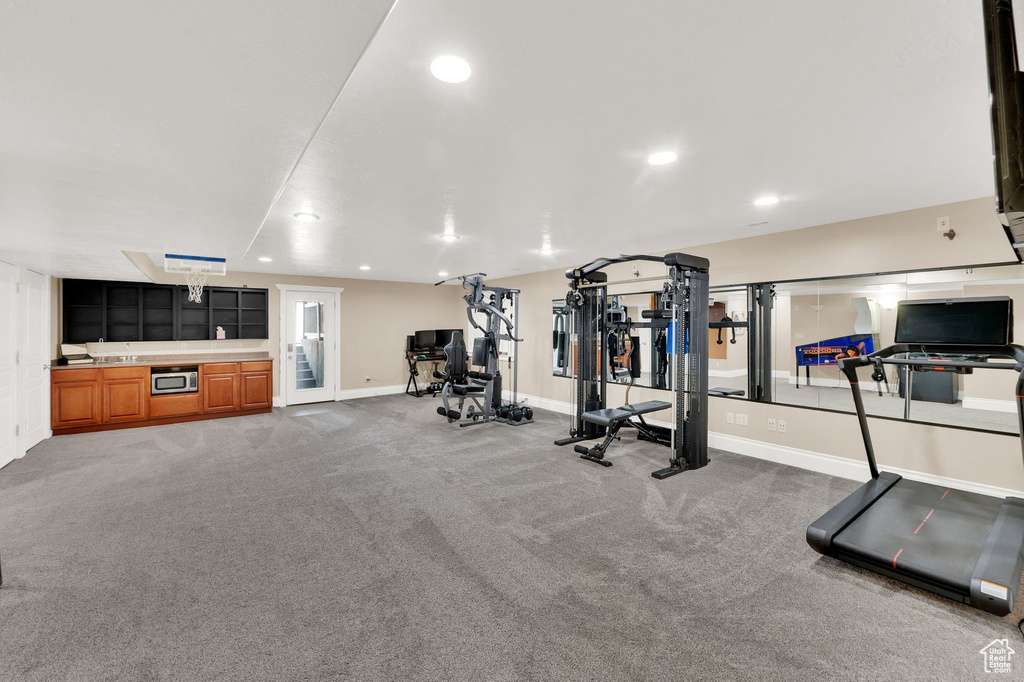 Workout area featuring recessed lighting