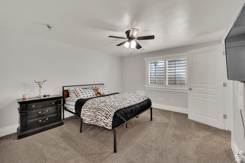 Bedroom with carpet flooring and ceiling fan