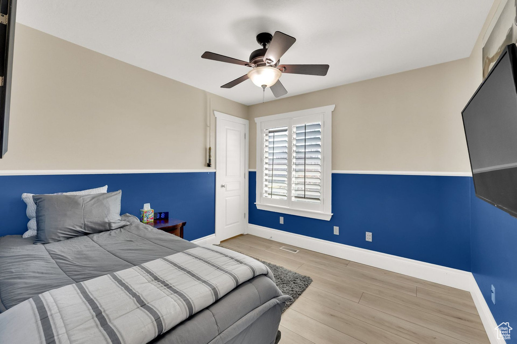 Bedroom featuring wood finished floors and ceiling fan