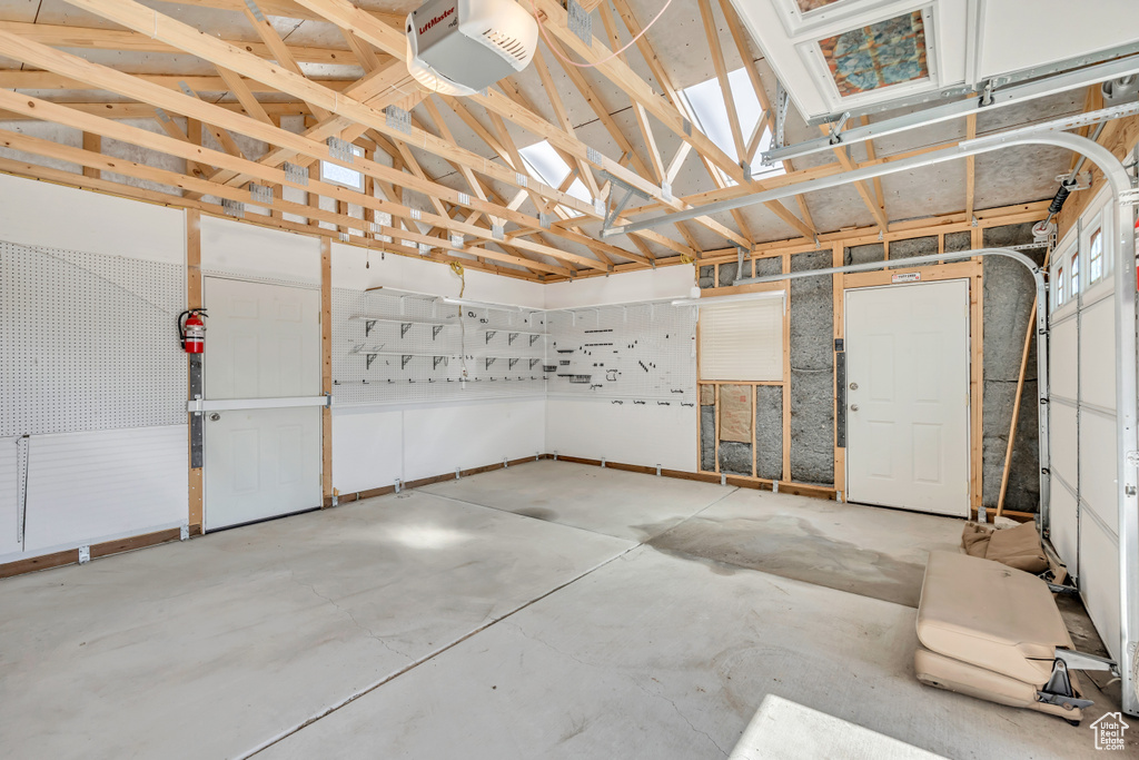 Garage featuring a garage door opener