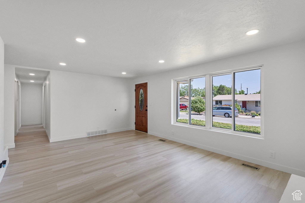Spare room featuring recessed lighting and light wood-style floors