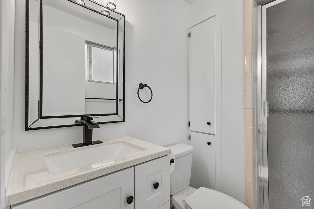 Bathroom with vanity and an enclosed shower